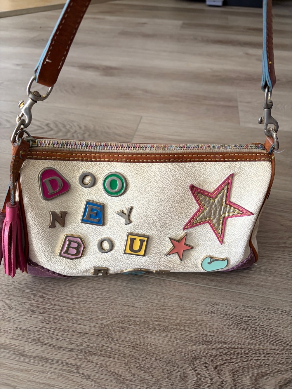 Dooney & Bourke Cream Leather Shoulder Bag with Colorful Patch Accents